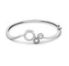A classy design with progressive loops studded with diamonds. Code PTS8