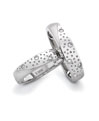 A starry effect pair of platinum love bands in matt finish and flush set diamonds
